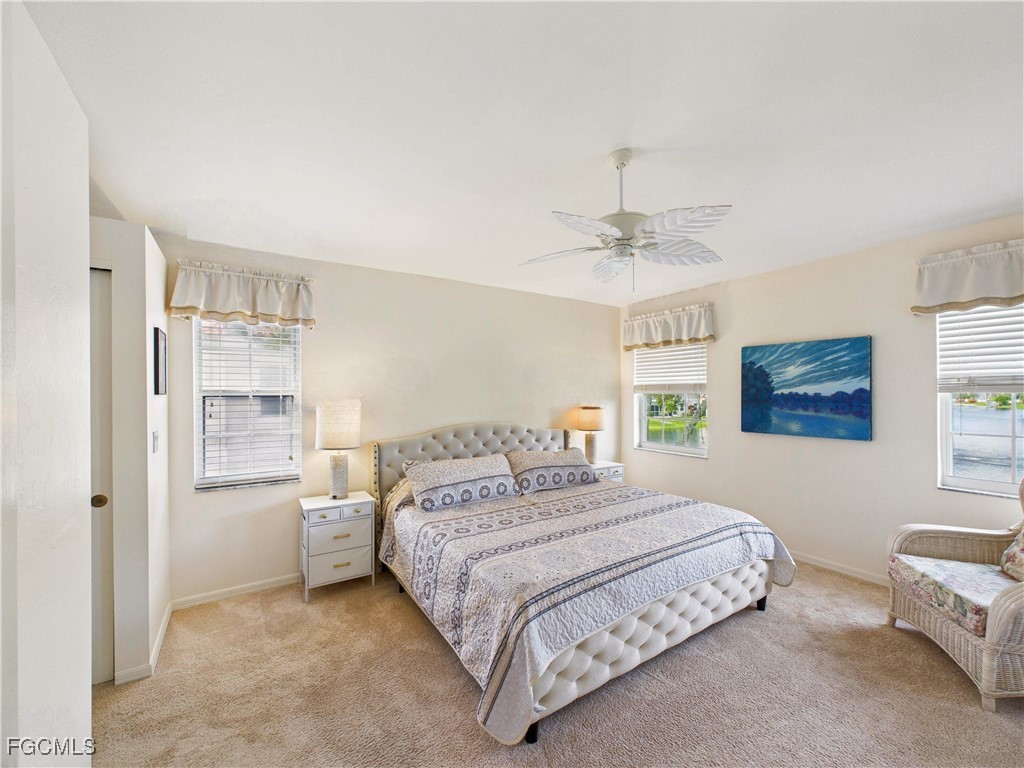 7435 Plumbago Bridge Road, Unit K201 Naples, FL 34109 - Photo 19 of 35 a bedroom with a bed and a window