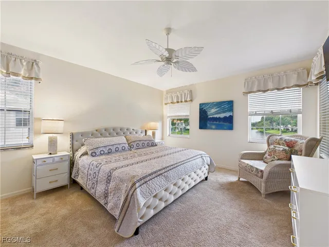 a bedroom with bed and window