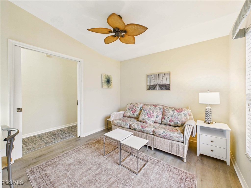7435 Plumbago Bridge Road, Unit K201 Naples, FL 34109 - Photo 27 of 35 a living room with furniture and a rug
