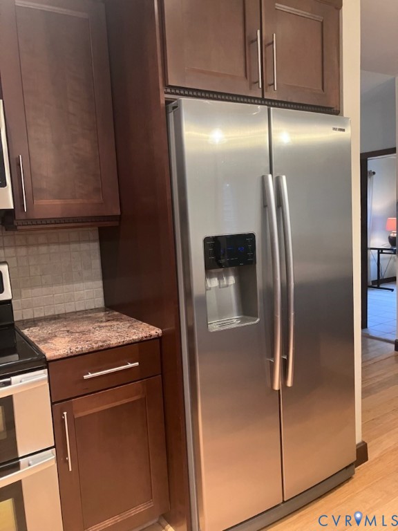 3901 McTyres Cove Court Midlothian, VA 23112 - Photo 5 of 11 a kitchen with metallic refrigerator freezer and a sink
