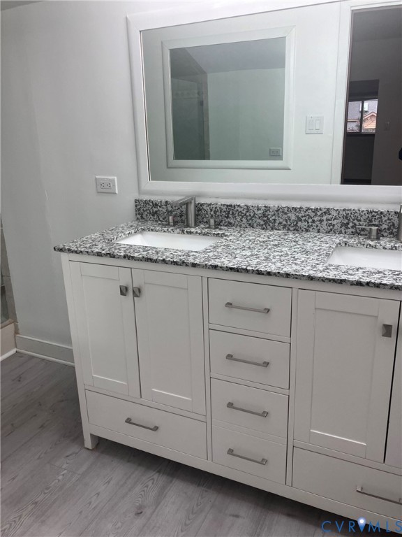 3901 McTyres Cove Court Midlothian, VA 23112 - Photo 7 of 11 a bathroom with a granite countertop sink and two mirror