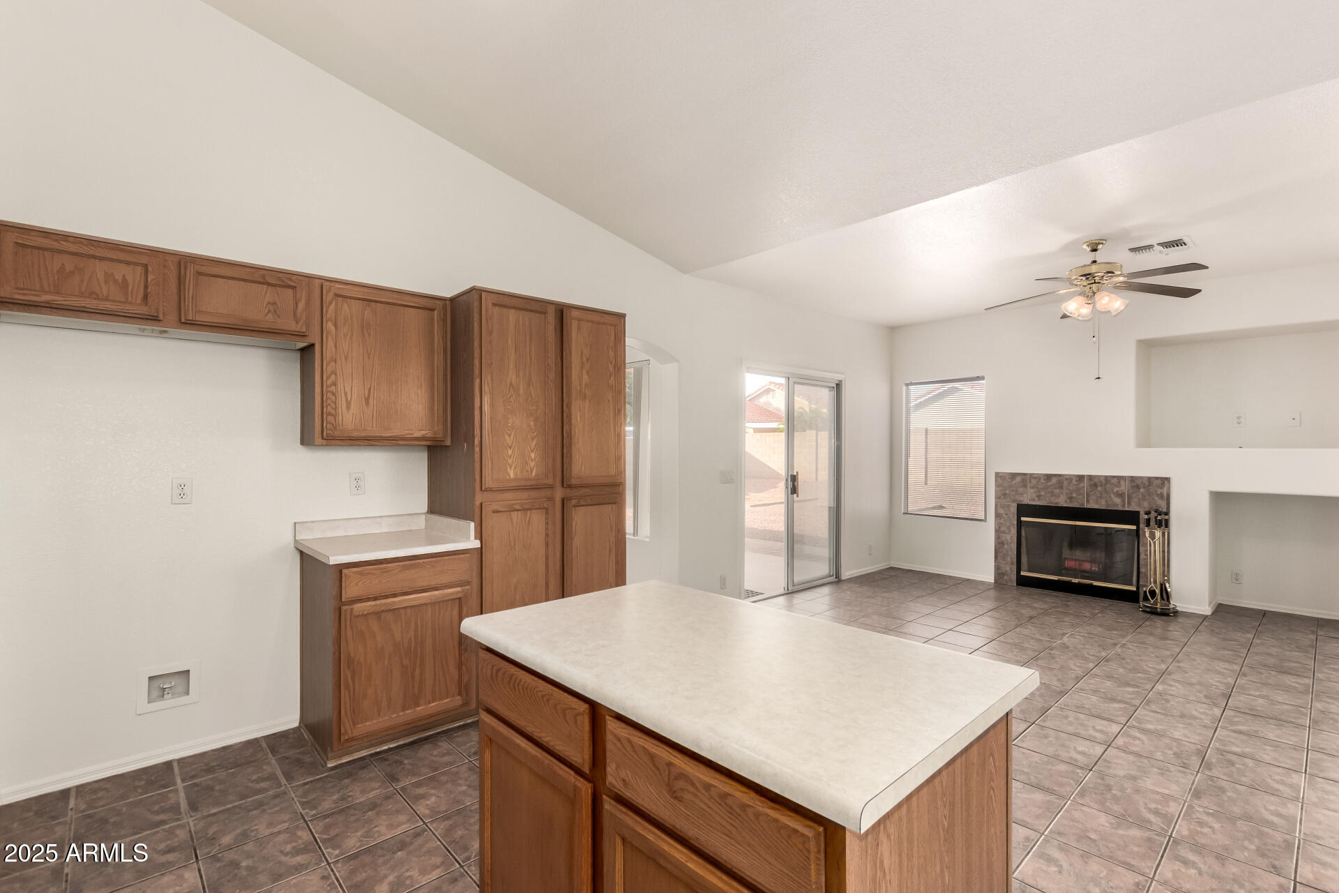 4010 West Wethersfield Road Phoenix, AZ 85029 - Photo 14 of 43 a kitchen with cabinets and wooden floor
