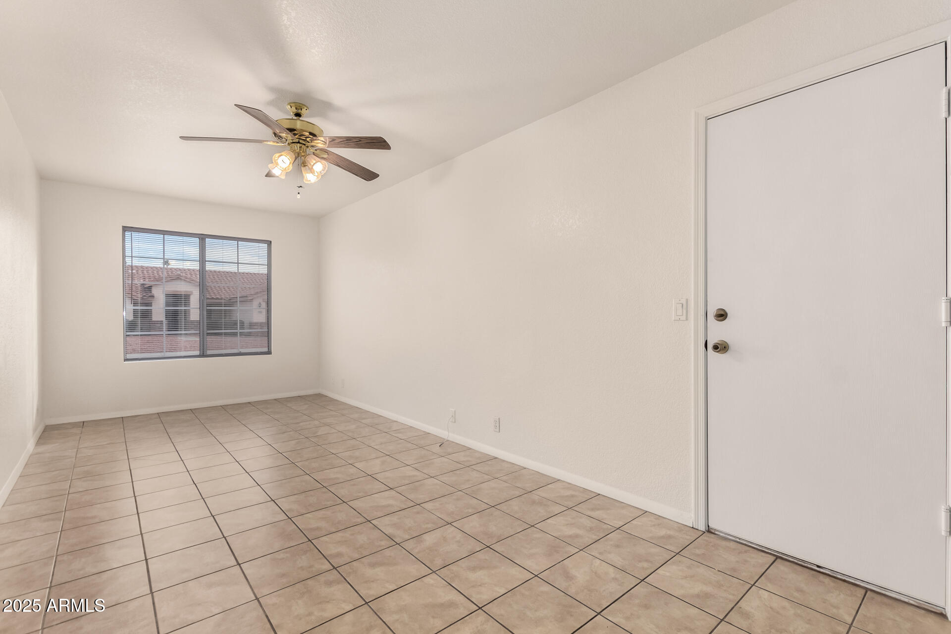 4010 West Wethersfield Road Phoenix, AZ 85029 - Photo 17 of 43 a view of an empty room with a window