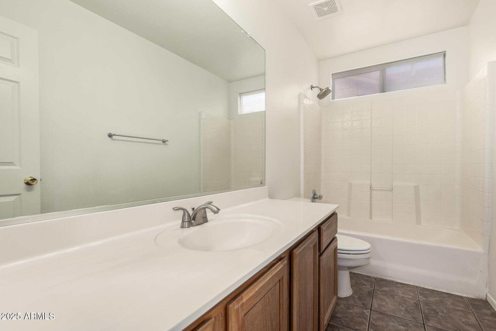 4010 West Wethersfield Road Phoenix, AZ 85029 - Photo 29 of 43 a bathroom with a sink a toilet and shower