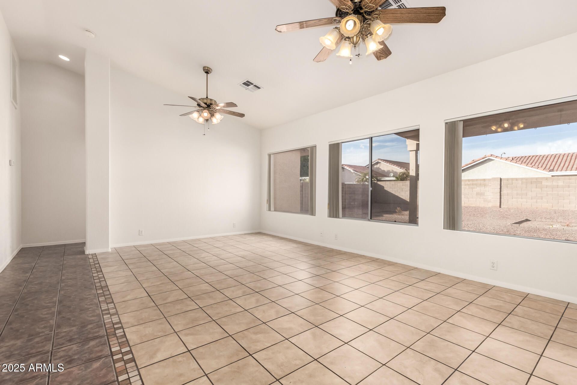 4010 West Wethersfield Road Phoenix, AZ 85029 - Photo 4 of 43 a view of an empty room with a window