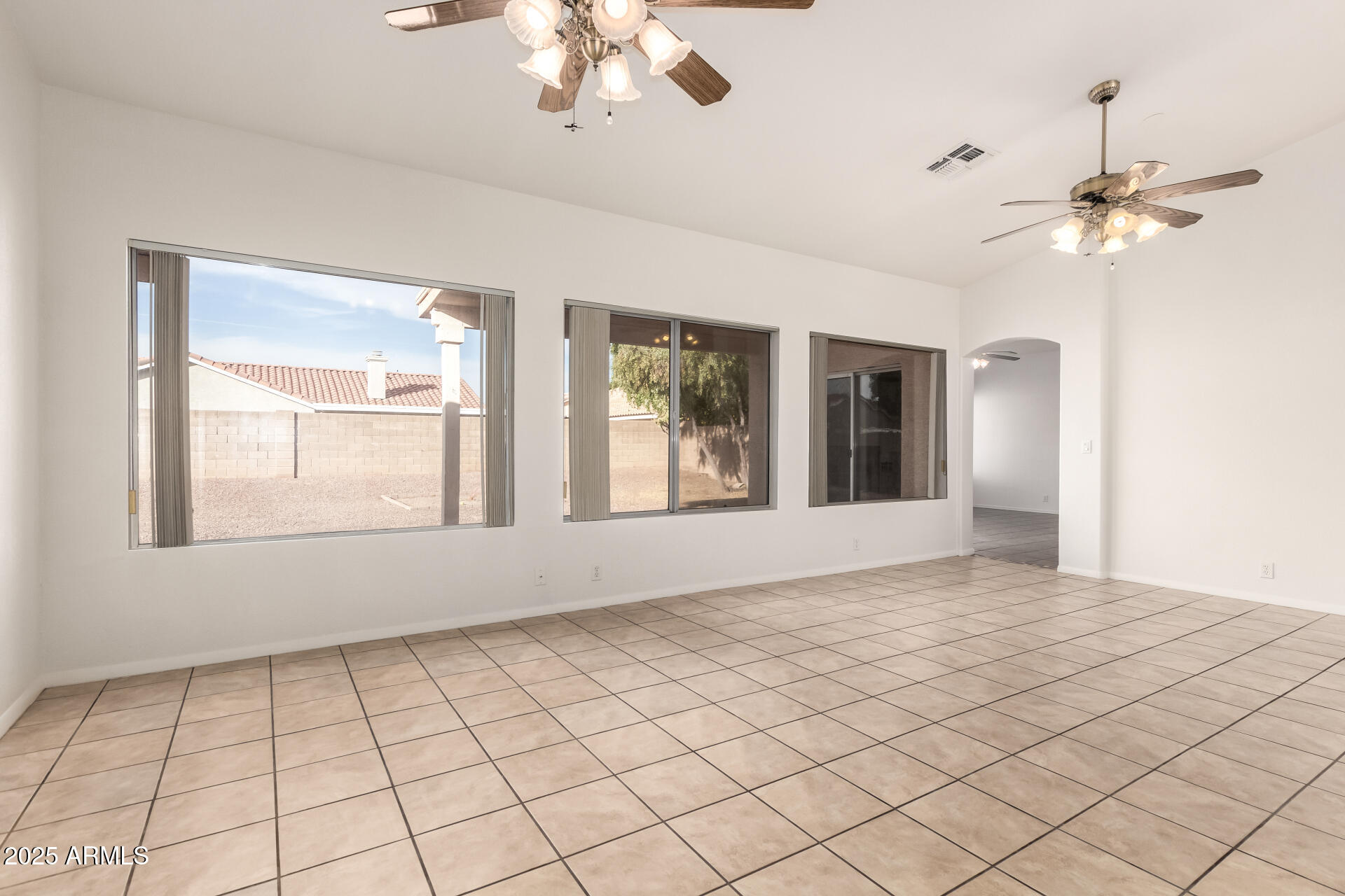 4010 West Wethersfield Road Phoenix, AZ 85029 - Photo 5 of 43 a view of an empty room with a window