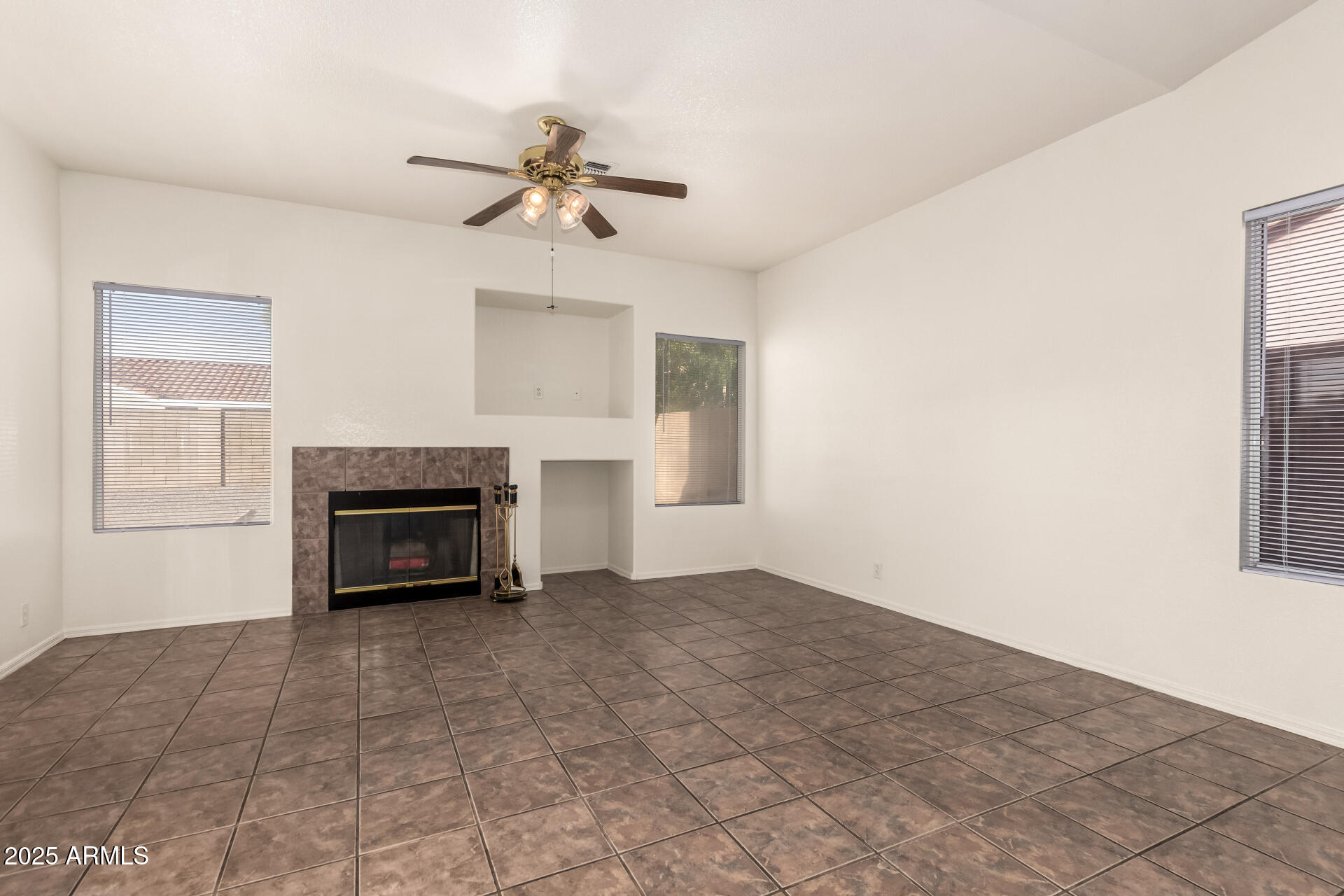 4010 West Wethersfield Road Phoenix, AZ 85029 - Photo 6 of 43 a view of main area with chandelier and fireplace