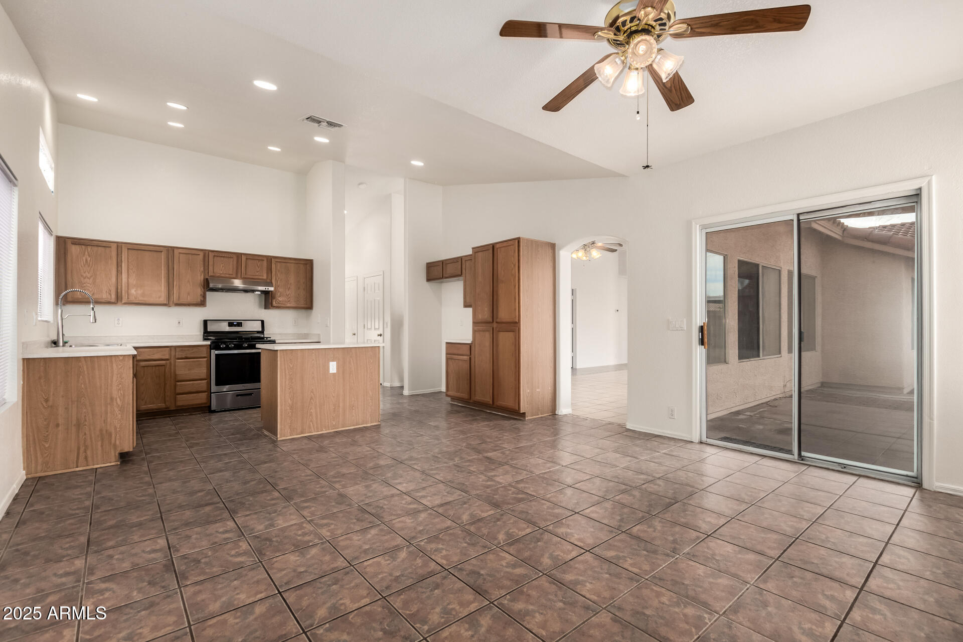 4010 West Wethersfield Road Phoenix, AZ 85029 - Photo 8 of 43 a view of a kitchen with refrigerator and cabinets