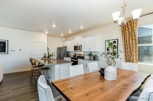 a kitchen with a table and chairs