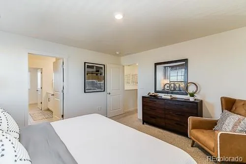 a bedroom with a bed and furniture