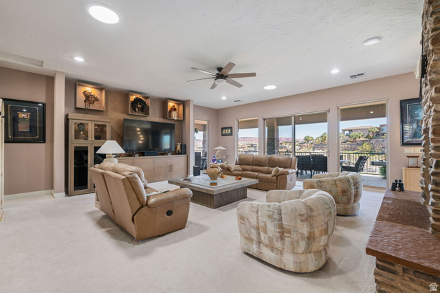 2376 Stone Crest Circle St. George, UT 84790 - Photo 6 of 61 Living room with a ceiling fan, recessed lighting, and light colored carpet