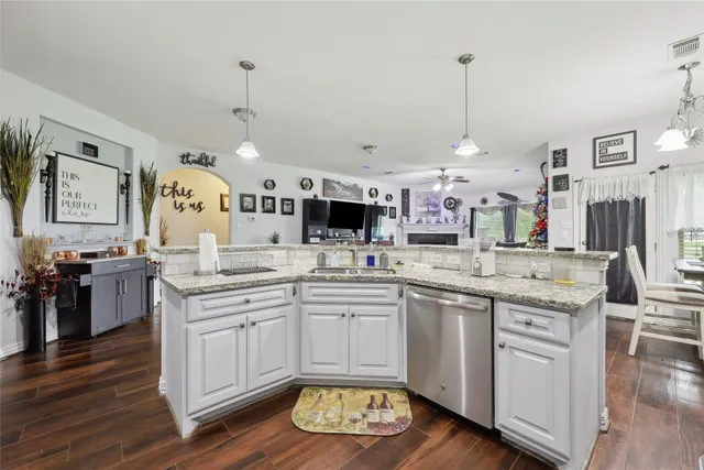a large kitchen with lots of counter space sink and appliances