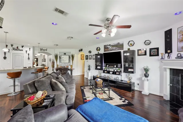 a view of a livingroom with furniture and a flat screen tv
