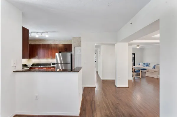 a white refrigerator freezer sitting inside of a kitchen