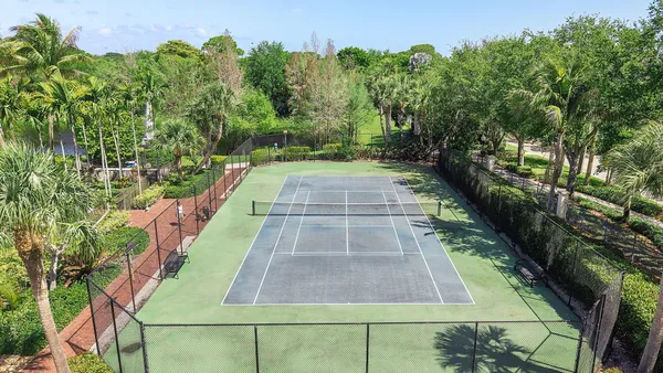 an aerial view of residential houses with city view