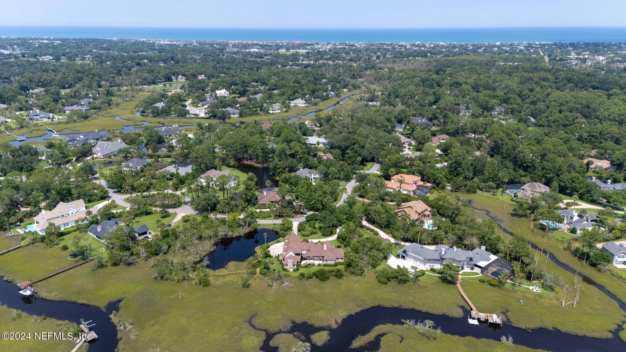 24629 Deer Trace Drive Ponte Vedra Beach, FL 32082 - Photo 16 of 45 an aerial view of a house with a yard and lake view