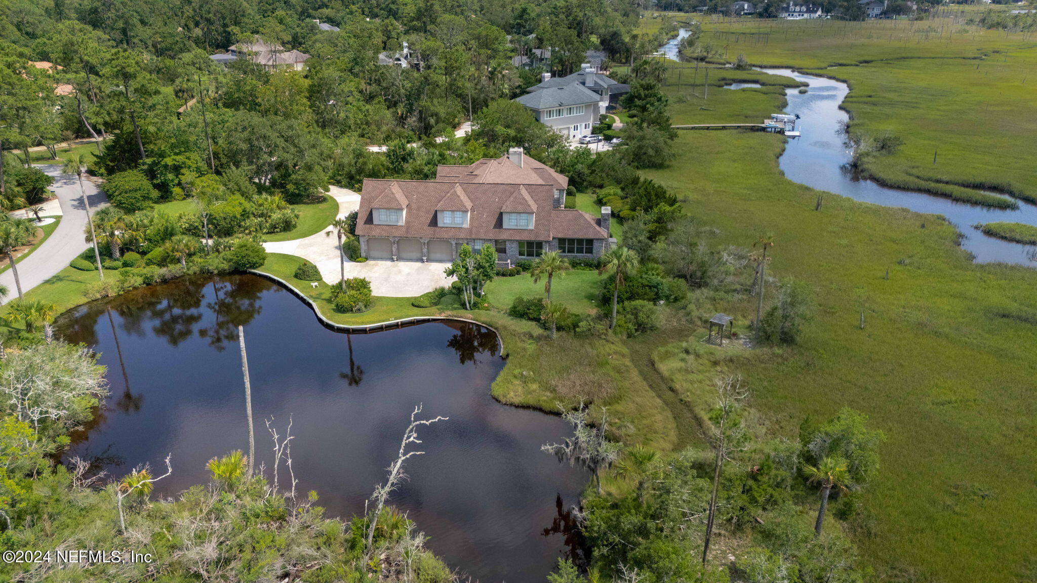 24629 Deer Trace Drive Ponte Vedra Beach, FL 32082 - Photo 22 of 45 an aerial view of a house with a garden and lake view