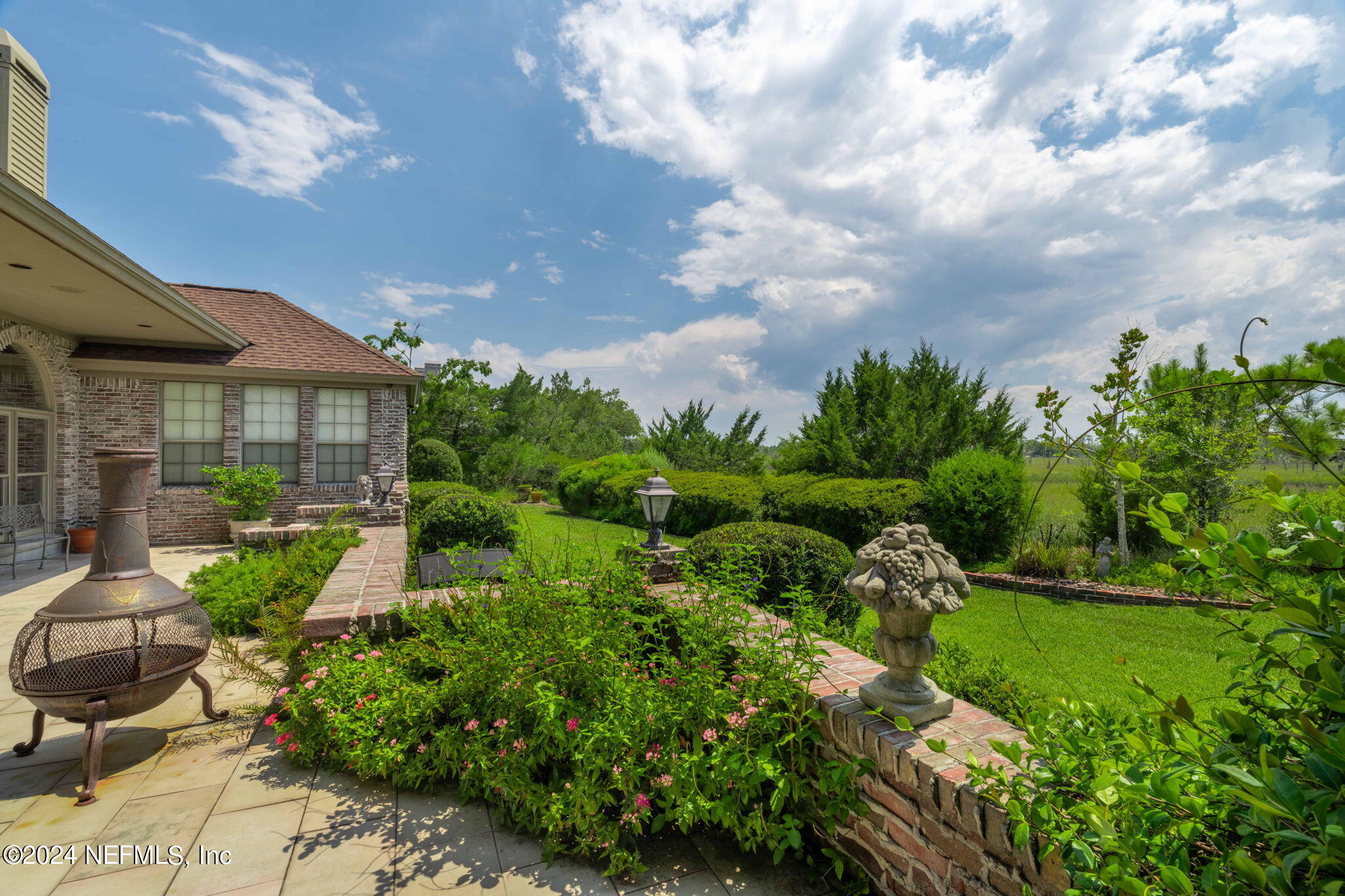 24629 Deer Trace Drive Ponte Vedra Beach, FL 32082 - Photo 34 of 45 a view of a house with a yard and garden