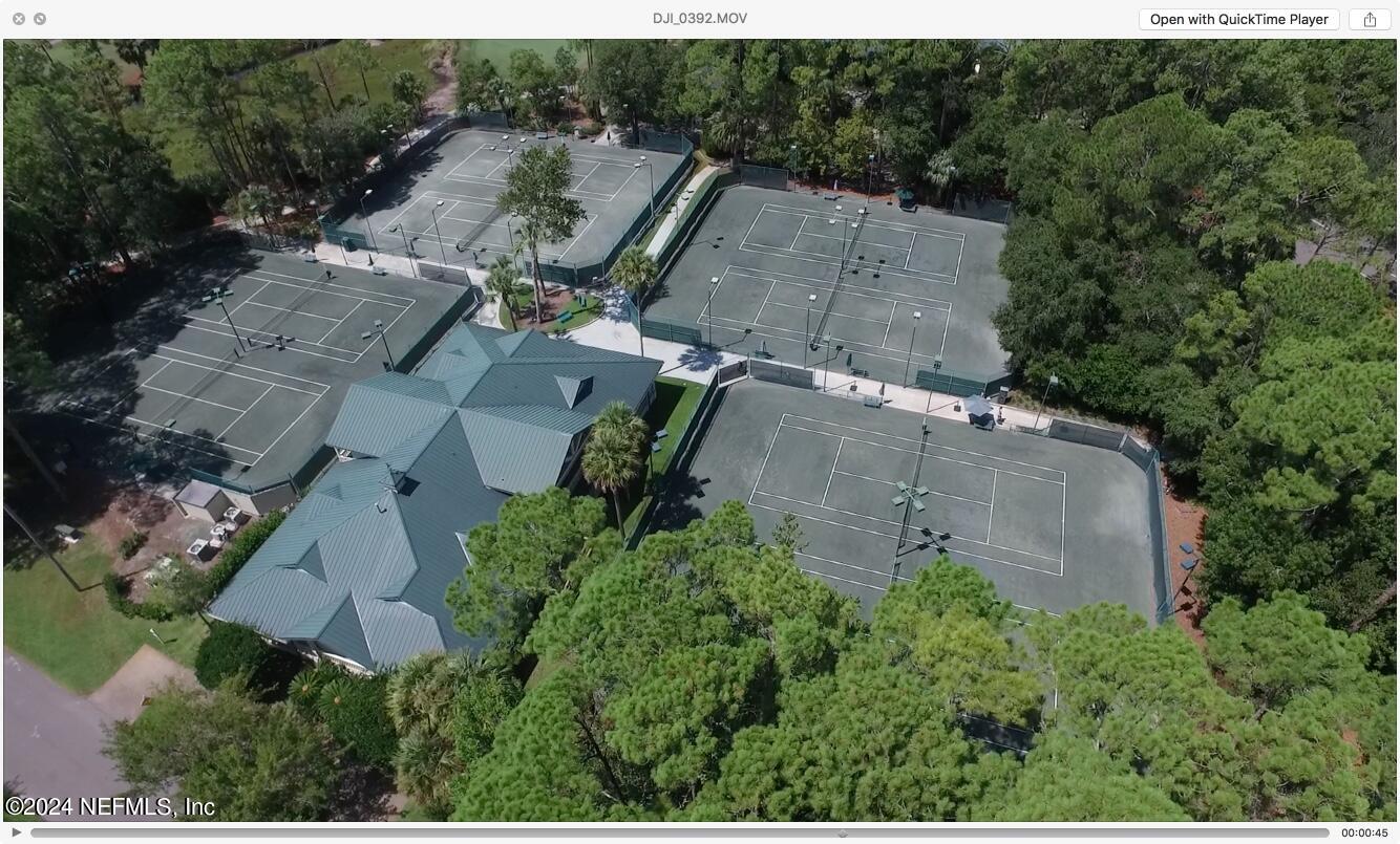 24629 Deer Trace Drive Ponte Vedra Beach, FL 32082 - Photo 42 of 45 an aerial view of a house with a garden and trees