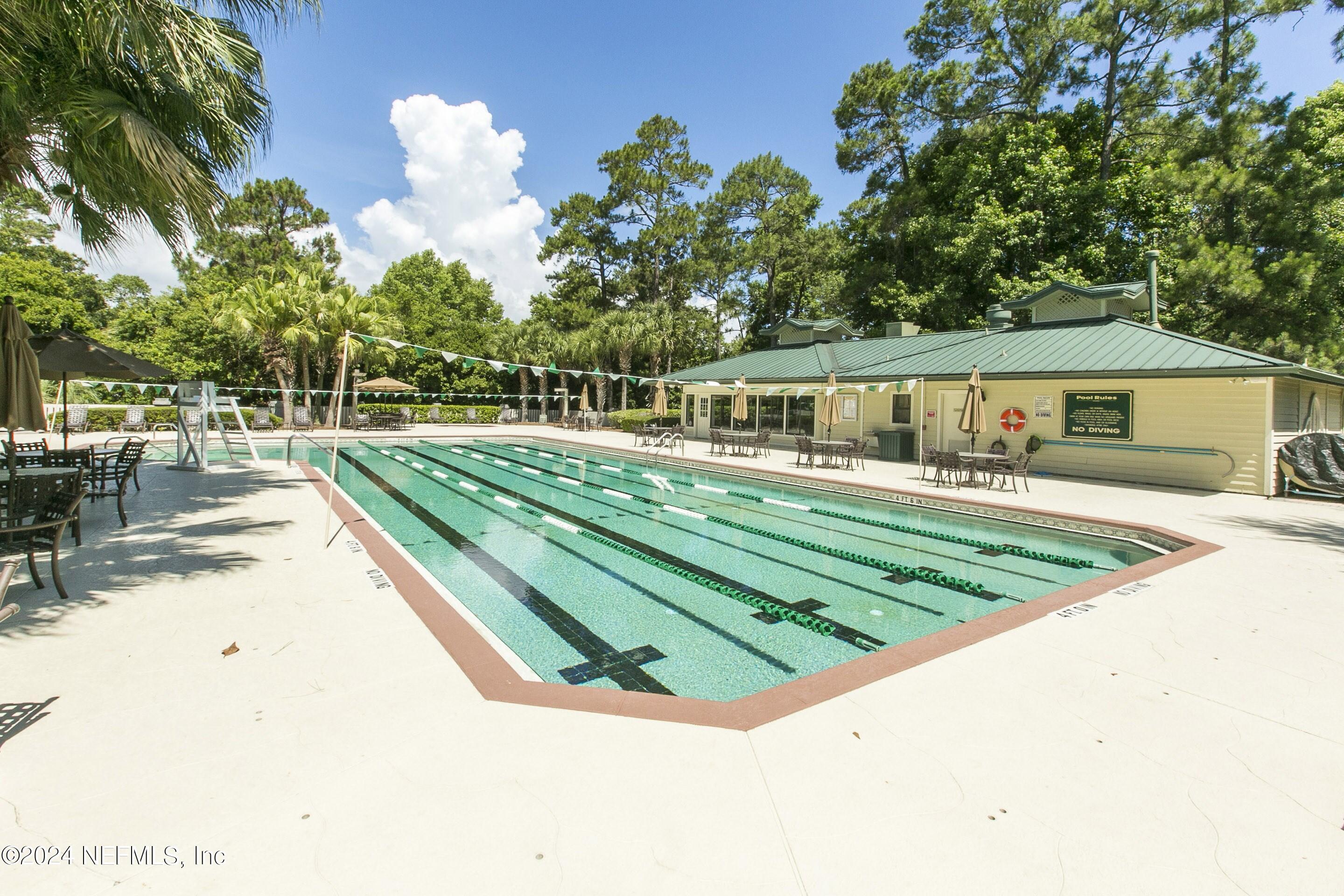 24629 Deer Trace Drive Ponte Vedra Beach, FL 32082 - Photo 44 of 45 a view of swimming pool with outdoor seating and plants