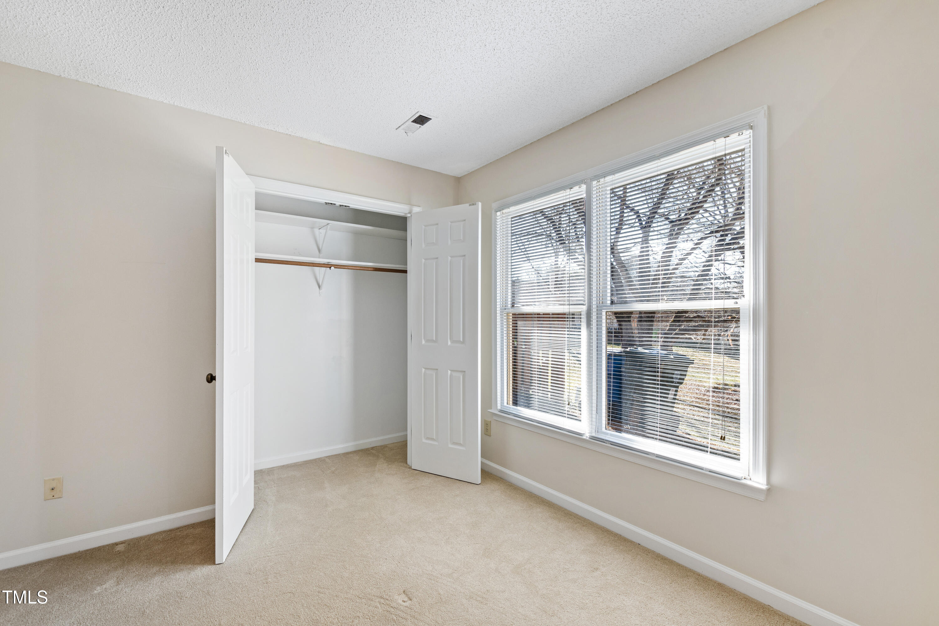 2615 Cottage Circle Raleigh, NC 27613 - Photo 16 of 27 a view of an empty room with a window