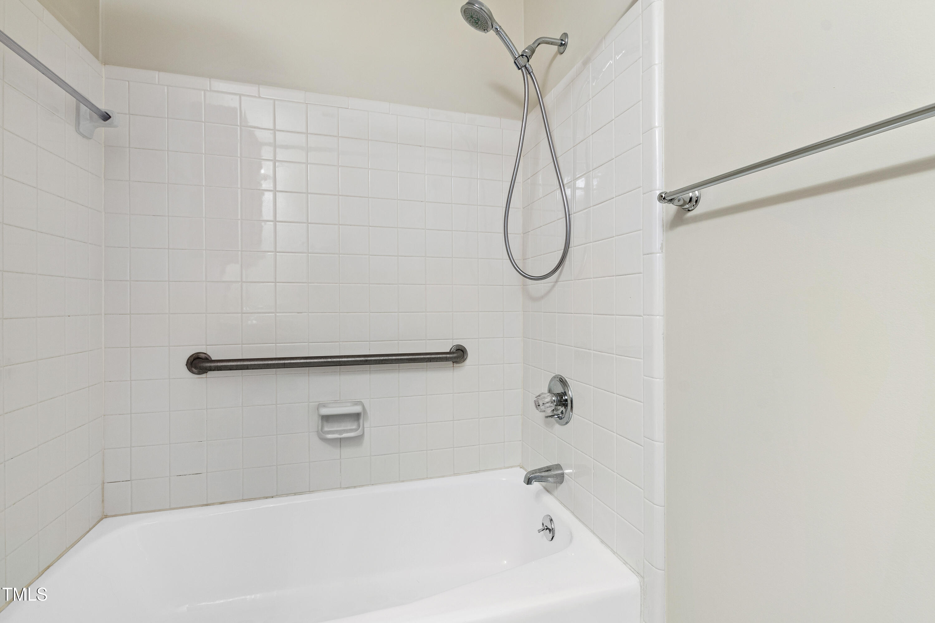 2615 Cottage Circle Raleigh, NC 27613 - Photo 22 of 27 a bathroom with a bath tub with a shower
