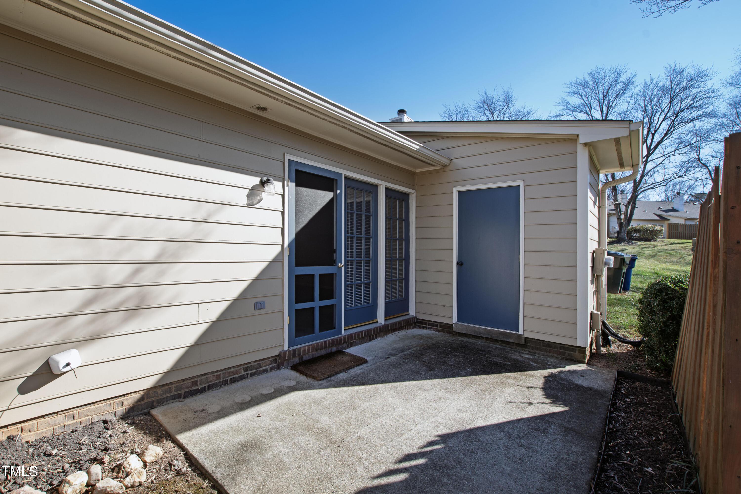2615 Cottage Circle Raleigh, NC 27613 - Photo 23 of 27 a view of house with wooden stairs and potted plants