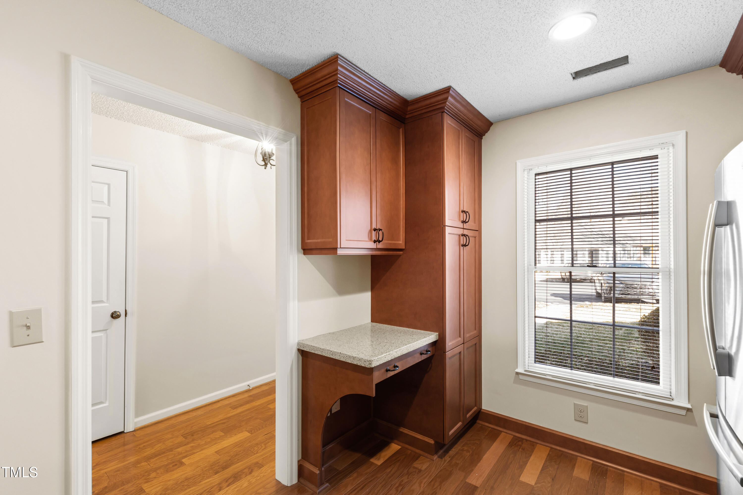 2615 Cottage Circle Raleigh, NC 27613 - Photo 9 of 27 an entryway view with wooden floor and cabinet