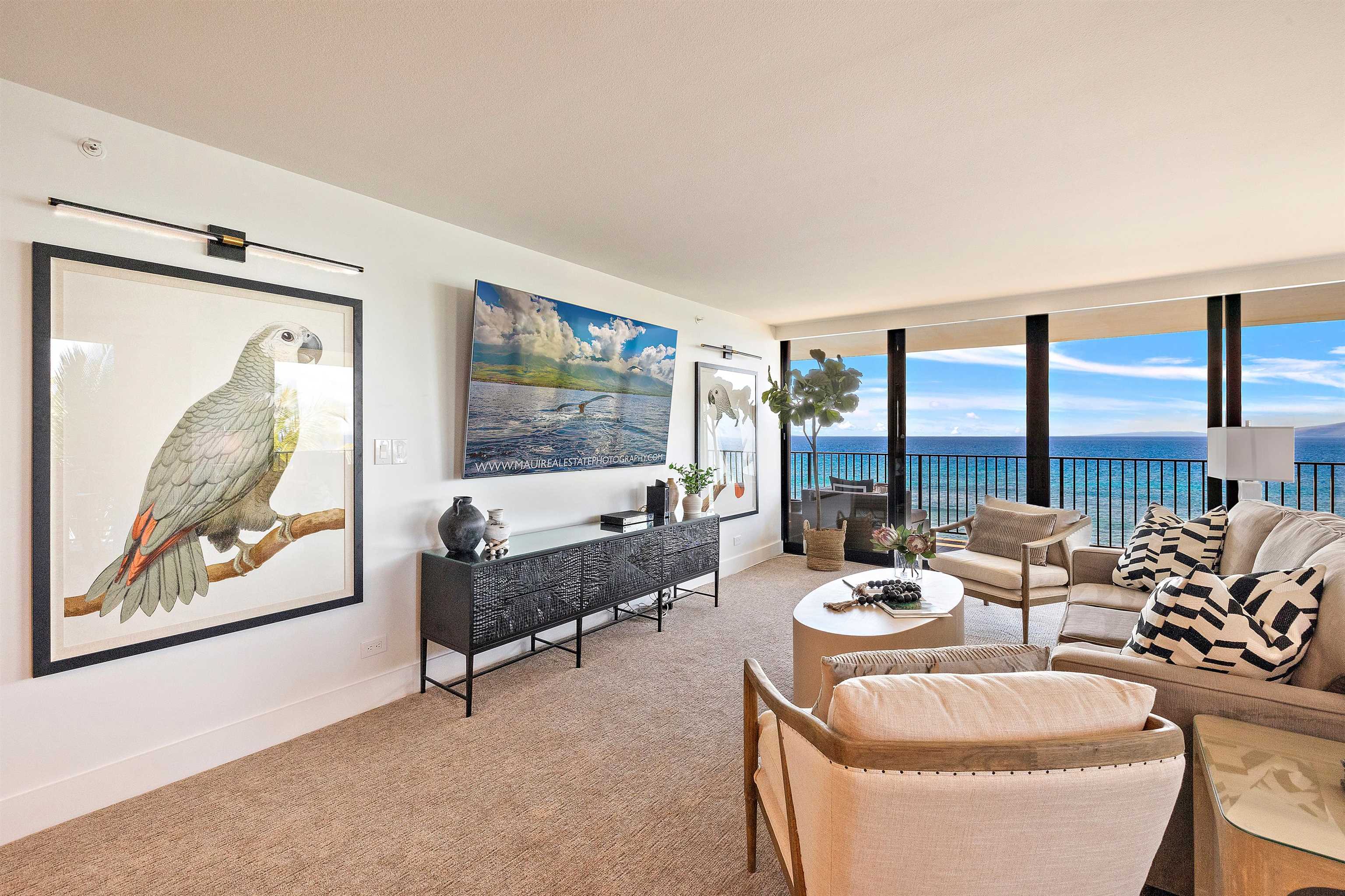 3445 Lower Honoapiilani Road, Unit 502 Lahaina, HI 96761 - Photo 12 of 50 a living room with furniture and a large window