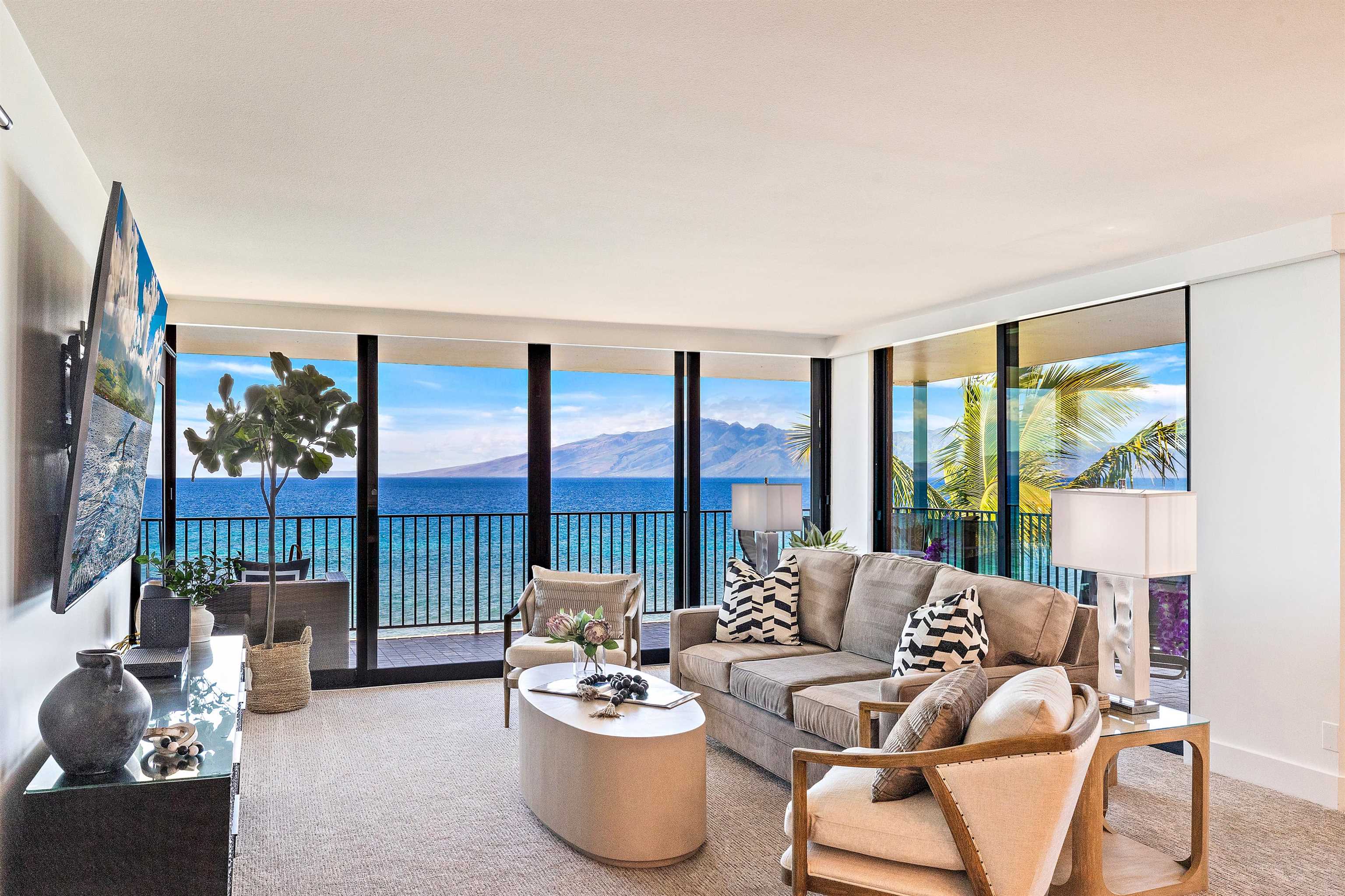 3445 Lower Honoapiilani Road, Unit 502 Lahaina, HI 96761 - Photo 13 of 50 a living room with furniture and a large window