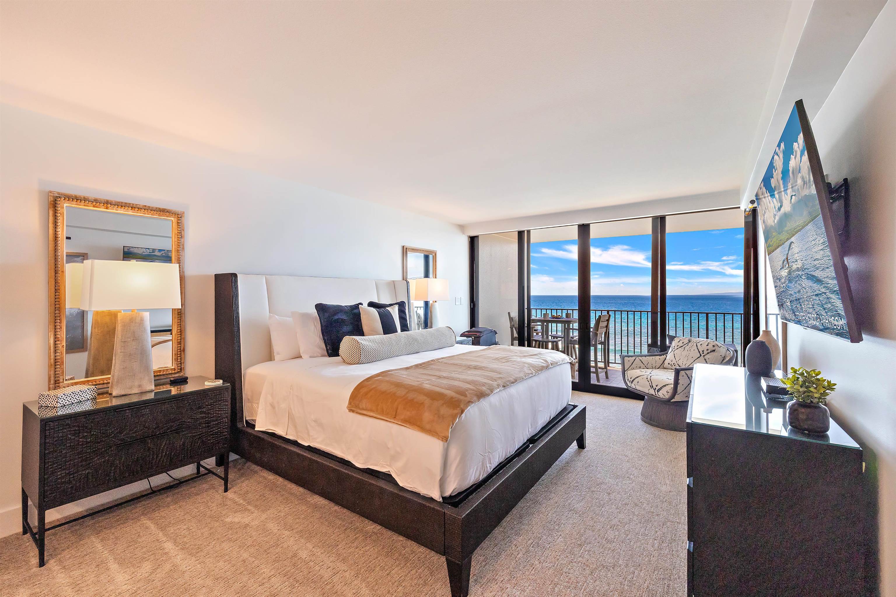 3445 Lower Honoapiilani Road, Unit 502 Lahaina, HI 96761 - Photo 25 of 50 a bedroom with a bed and a large window