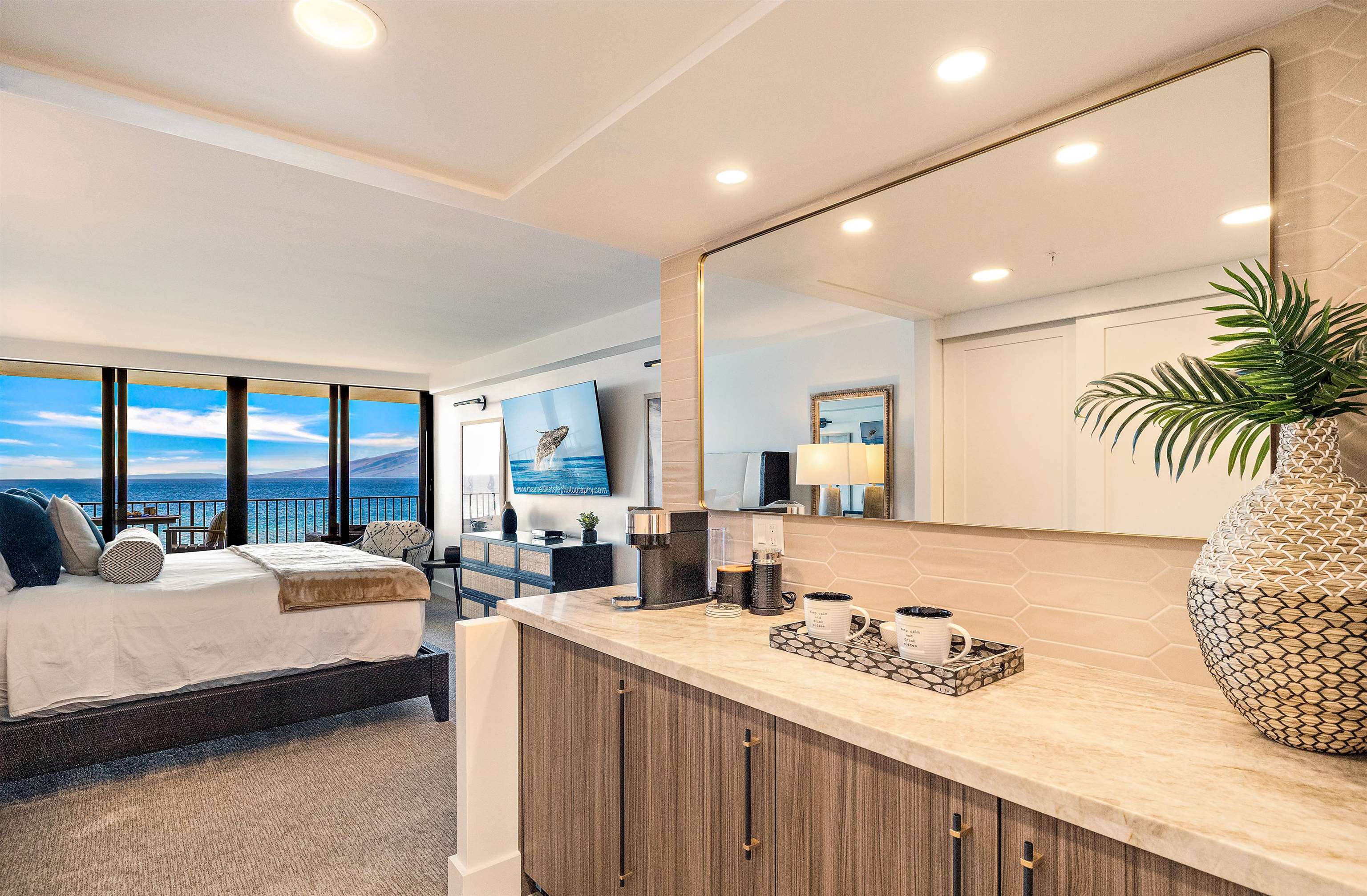 3445 Lower Honoapiilani Road, Unit 502 Lahaina, HI 96761 - Photo 28 of 50 a bedroom with furniture and large windows