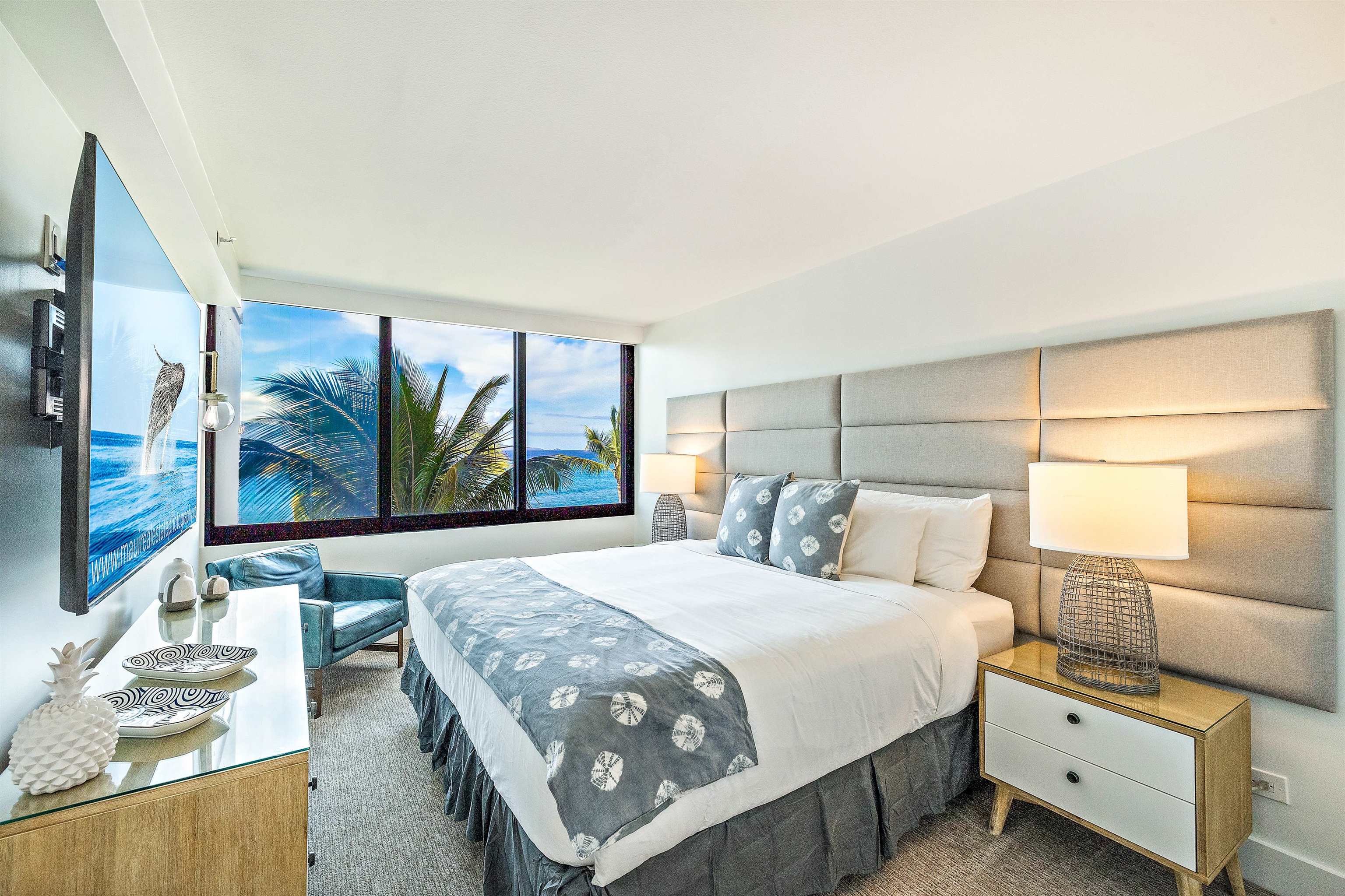 3445 Lower Honoapiilani Road, Unit 502 Lahaina, HI 96761 - Photo 36 of 50 a bedroom with a large bed and a large window