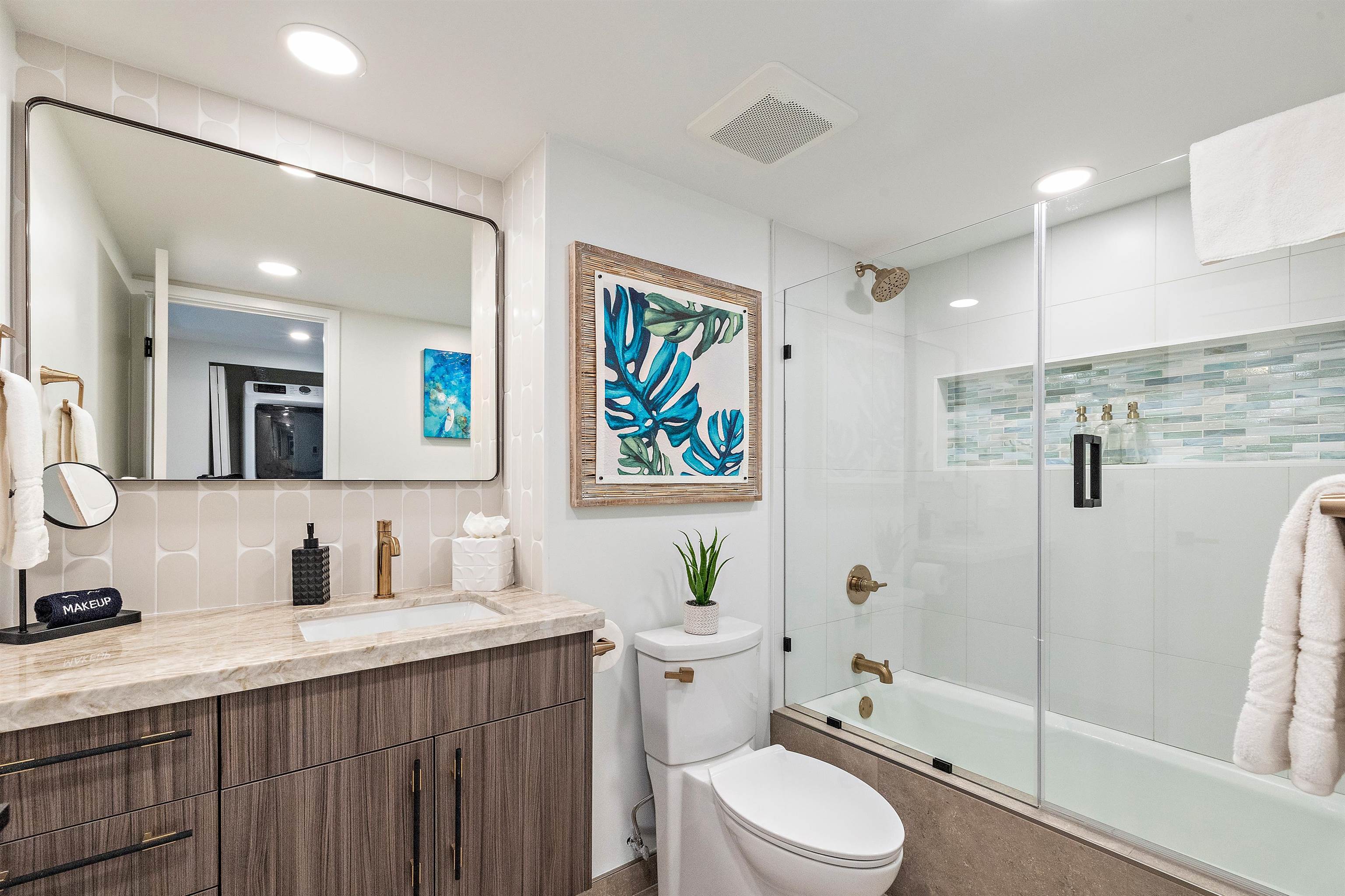 3445 Lower Honoapiilani Road, Unit 502 Lahaina, HI 96761 - Photo 38 of 50 a bathroom with a sink a toilet a mirror a vanity and shower
