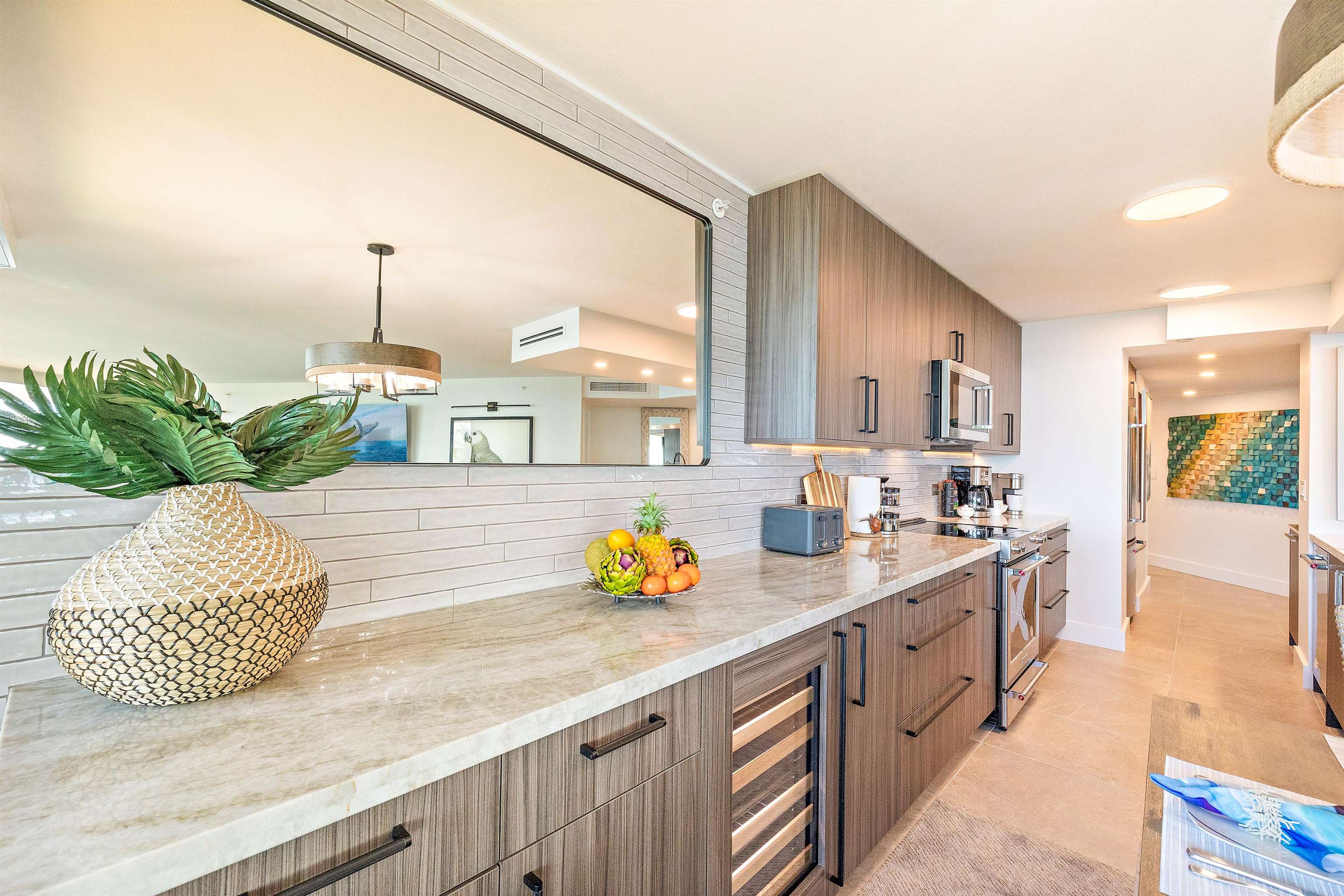 3445 Lower Honoapiilani Road, Unit 502 Lahaina, HI 96761 - Photo 8 of 50 a spacious bathroom with a granite countertop sink and a mirror