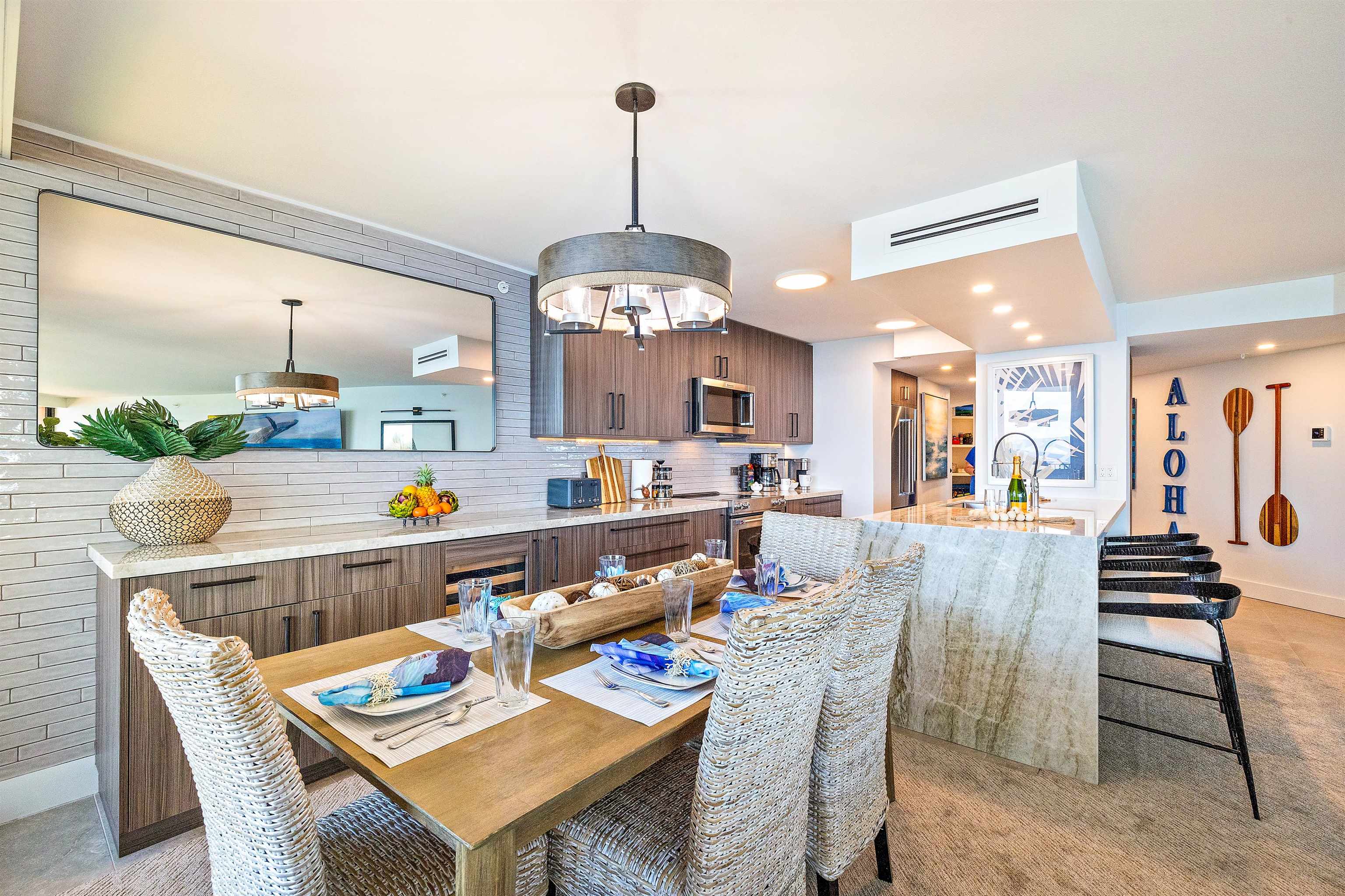 3445 Lower Honoapiilani Road, Unit 502 Lahaina, HI 96761 - Photo 9 of 50 a dining room with a table or chairs and a dining table with garden view