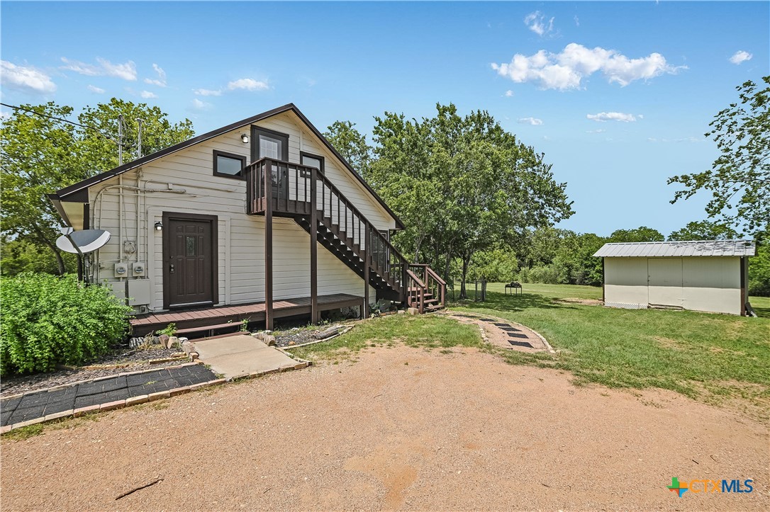 600 County Road 152 Georgetown, TX 78626 - Photo 16 of 24 a front view of a house with a yard and garage