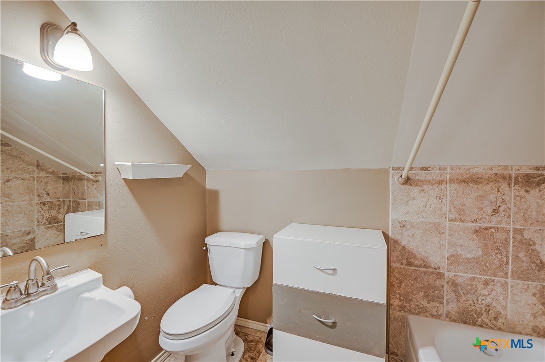 600 County Road 152 Georgetown, TX 78626 - Photo 19 of 24 a white toilet sitting next to a bathroom sink