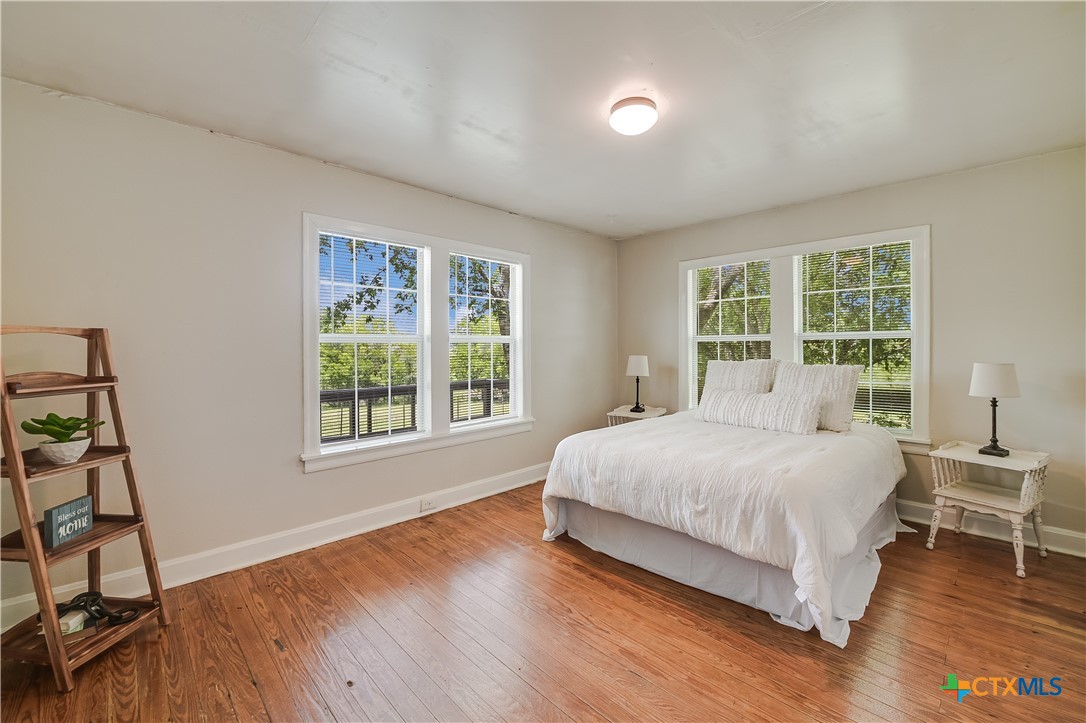 600 County Road 152 Georgetown, TX 78626 - Photo 9 of 24 a large bed sitting in a bedroom next to a window