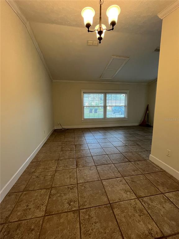 3222 Hammersmith Road Orlando, FL 32818 - Photo 10 of 17 a view of empty room with a window