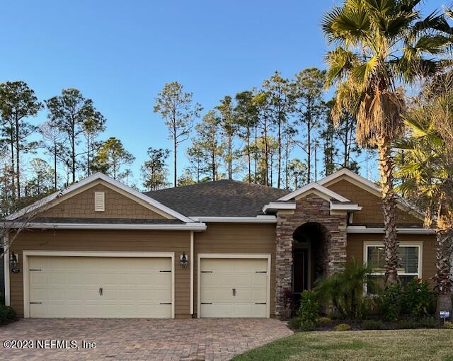 577 Aspen Leaf Drive Jacksonville, FL 32081 - Photo 105 of 106 a front view of a house with a yard and garage