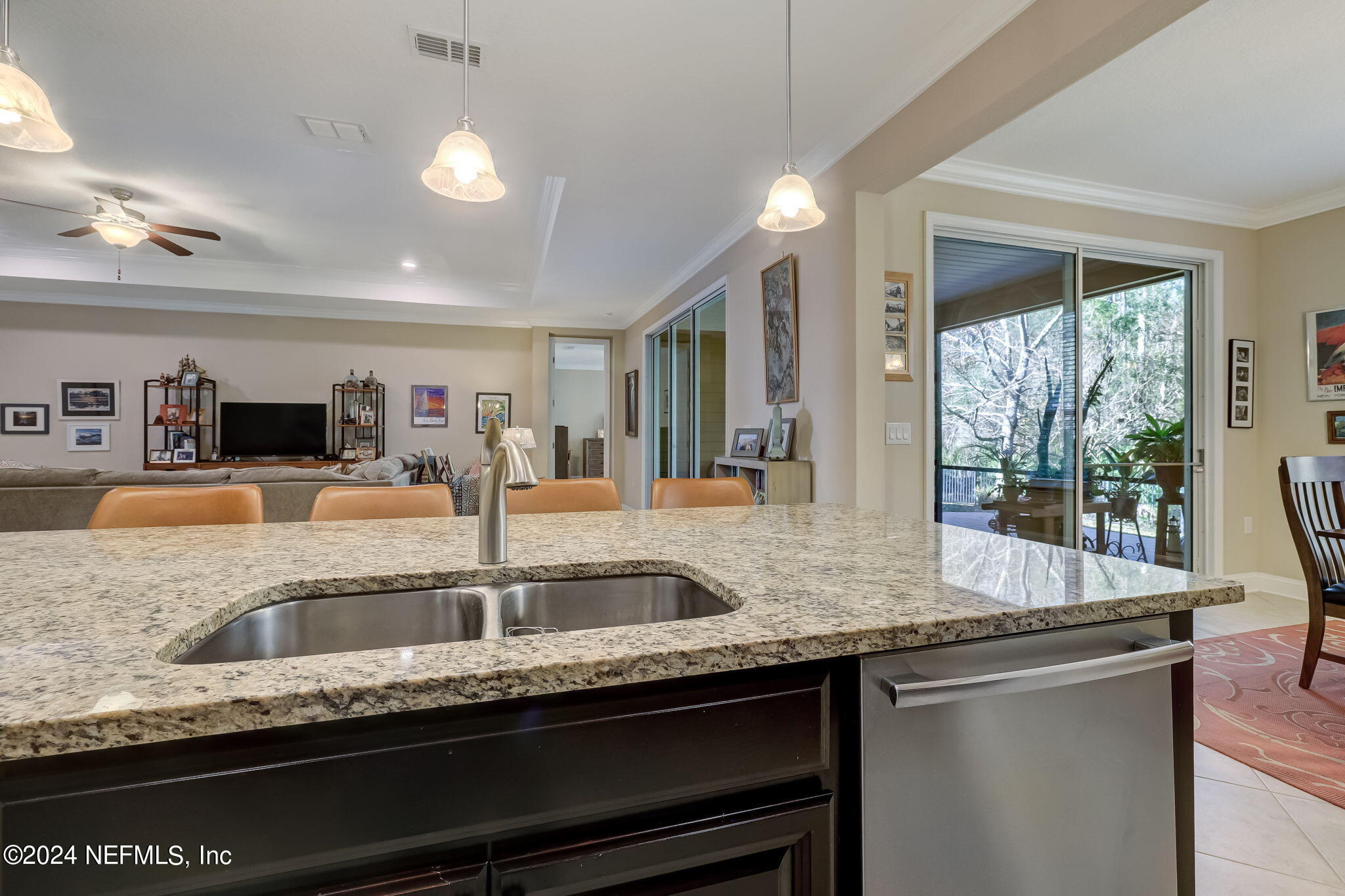 577 Aspen Leaf Drive Jacksonville, FL 32081 - Photo 12 of 106 a kitchen with granite countertop a sink and a counter top space