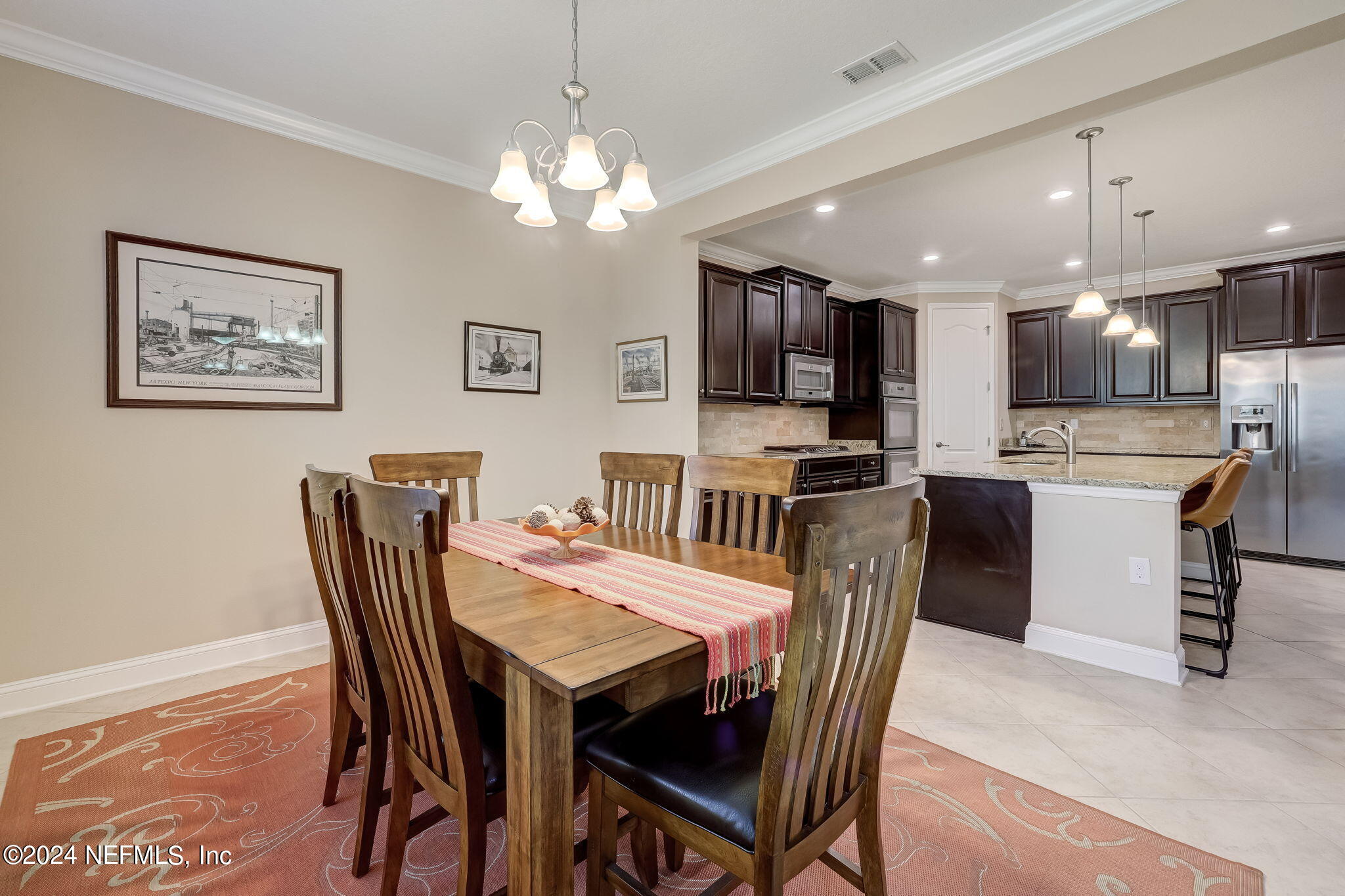 577 Aspen Leaf Drive Jacksonville, FL 32081 - Photo 14 of 106 a view of a dining room with furniture