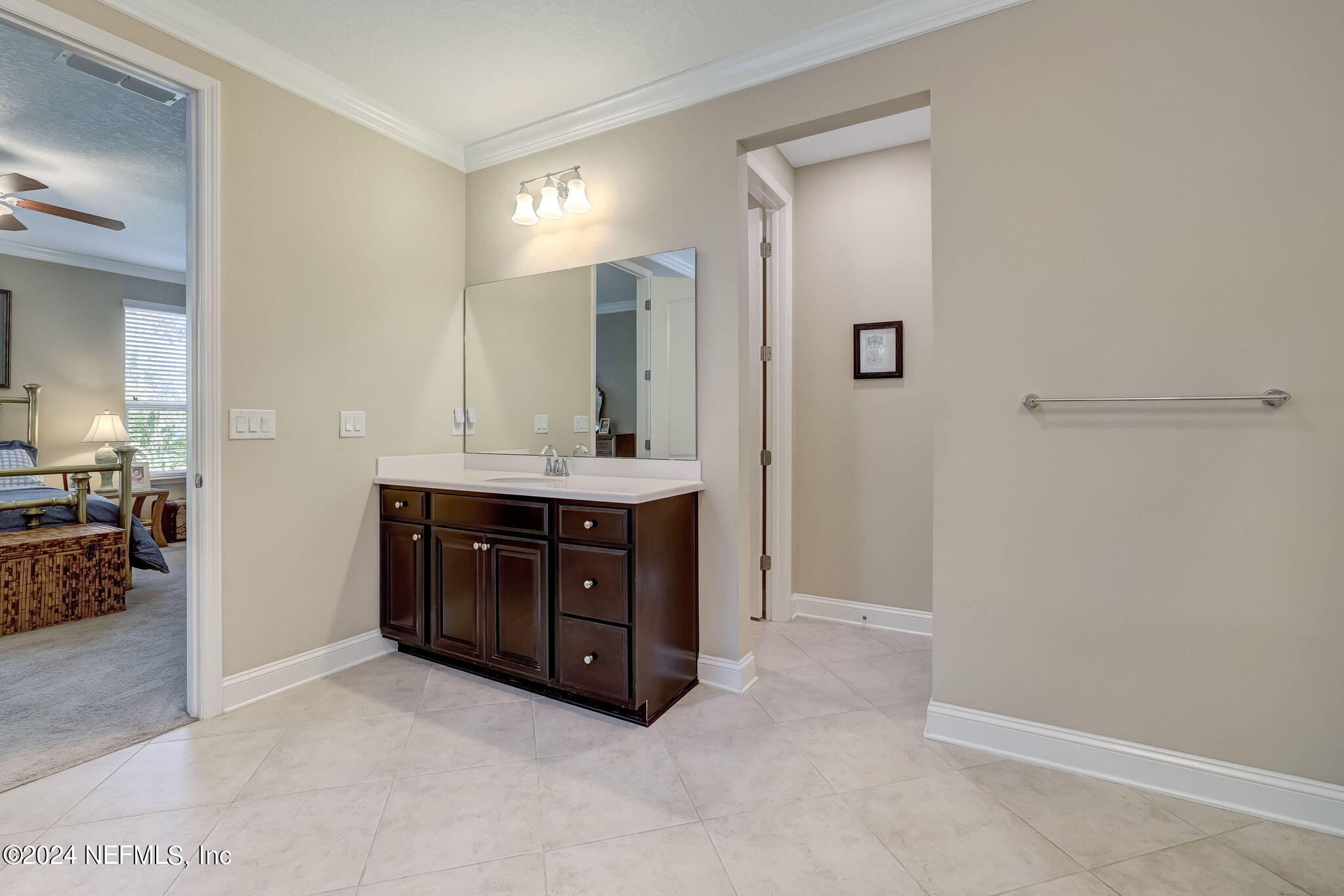 577 Aspen Leaf Drive Jacksonville, FL 32081 - Photo 20 of 106 a spacious bathroom with a vanity and a mirror