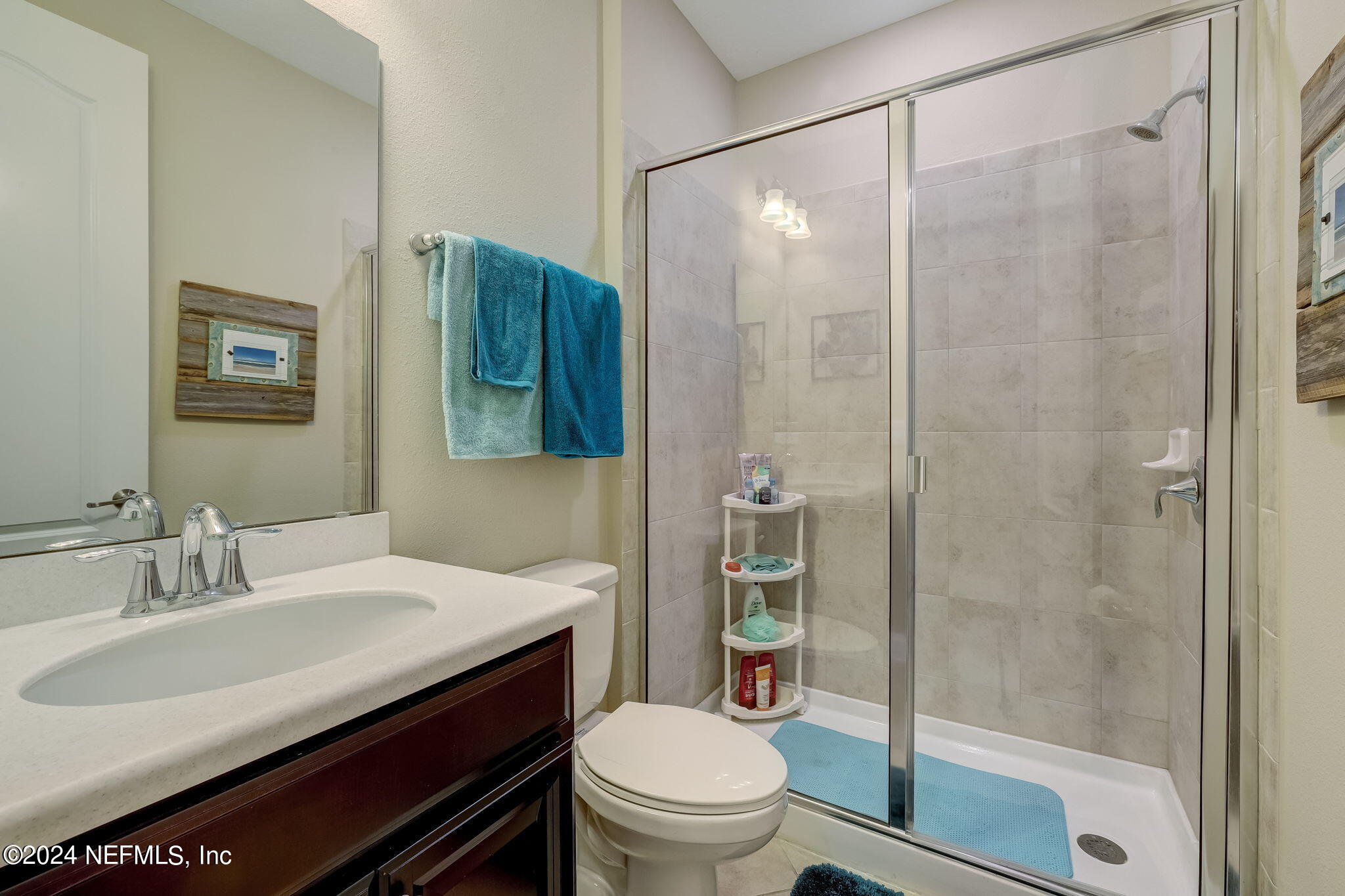 577 Aspen Leaf Drive Jacksonville, FL 32081 - Photo 23 of 106 a bathroom with a sink toilet and shower