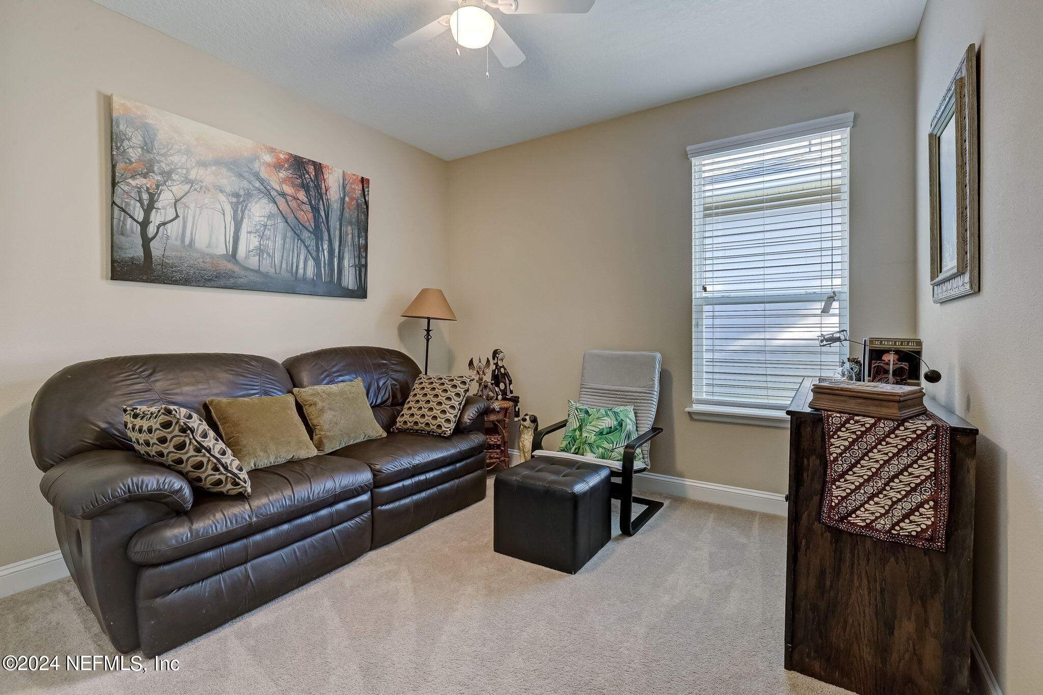 577 Aspen Leaf Drive Jacksonville, FL 32081 - Photo 24 of 106 a living room with furniture and a window