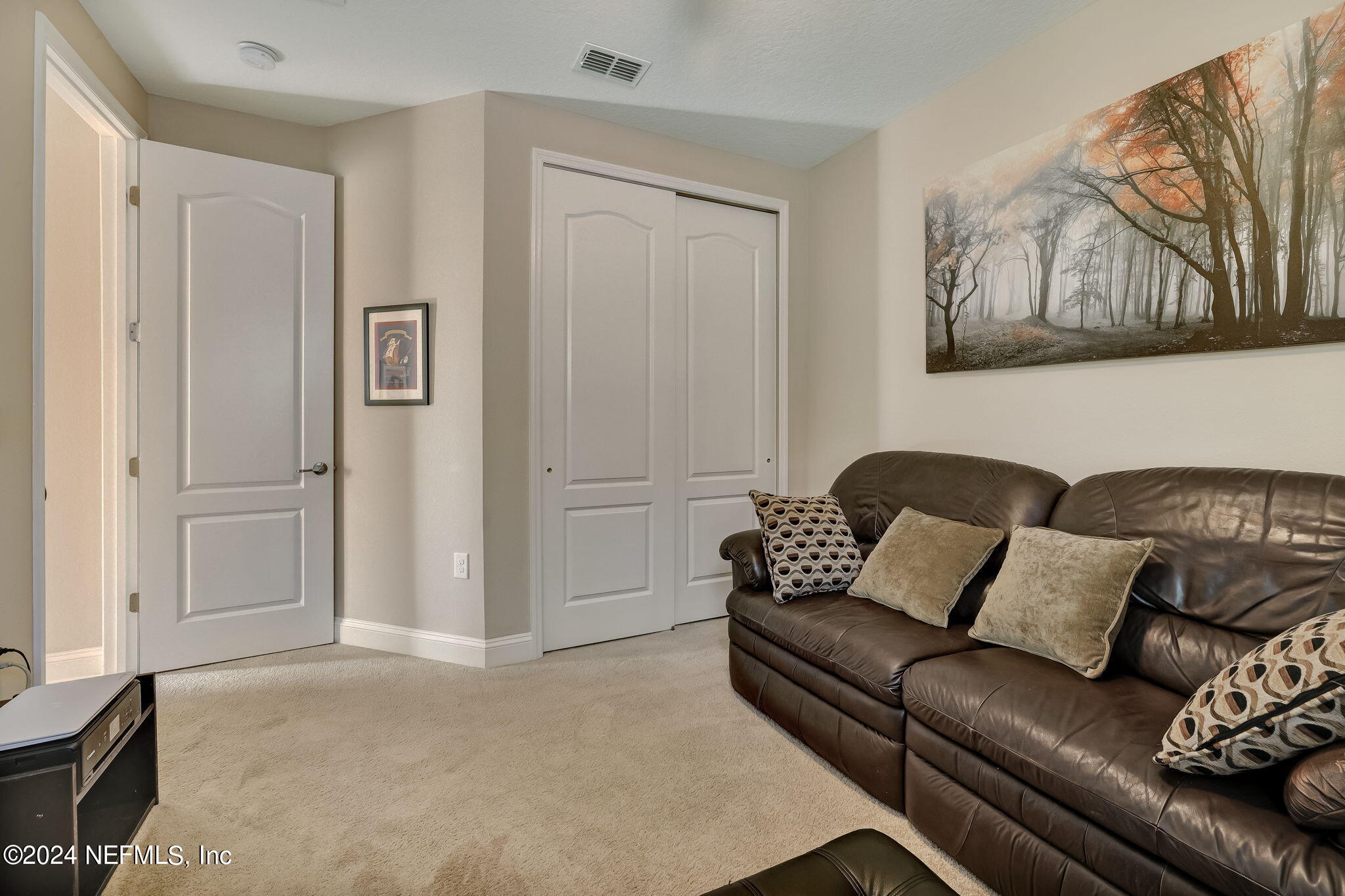 577 Aspen Leaf Drive Jacksonville, FL 32081 - Photo 25 of 106 a living room with furniture and a window