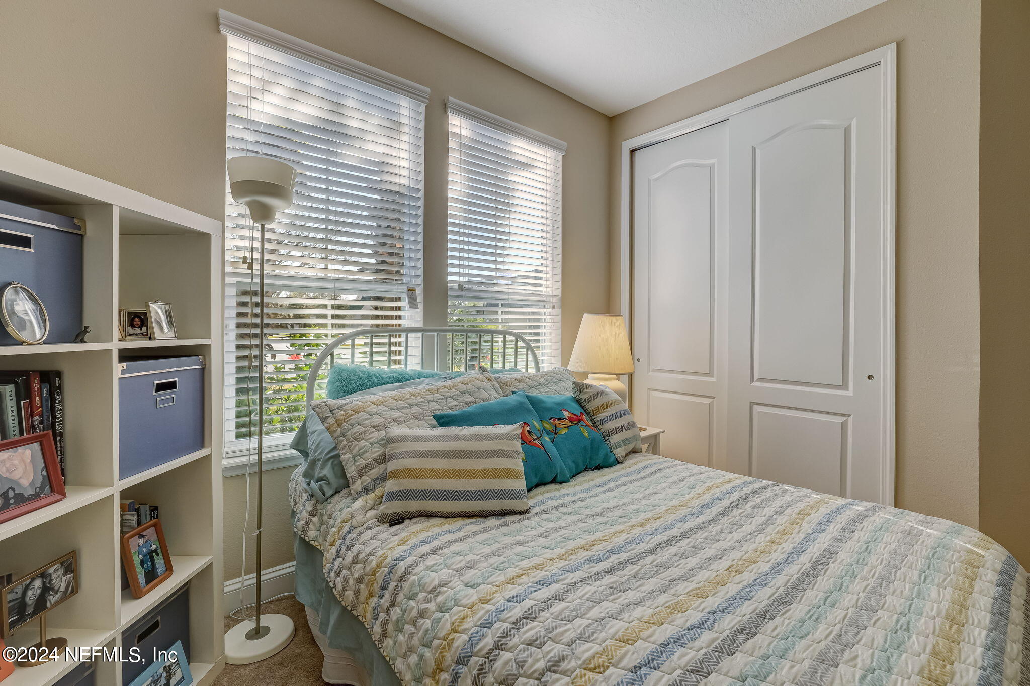 577 Aspen Leaf Drive Jacksonville, FL 32081 - Photo 28 of 106 a bedroom with a bed and a window