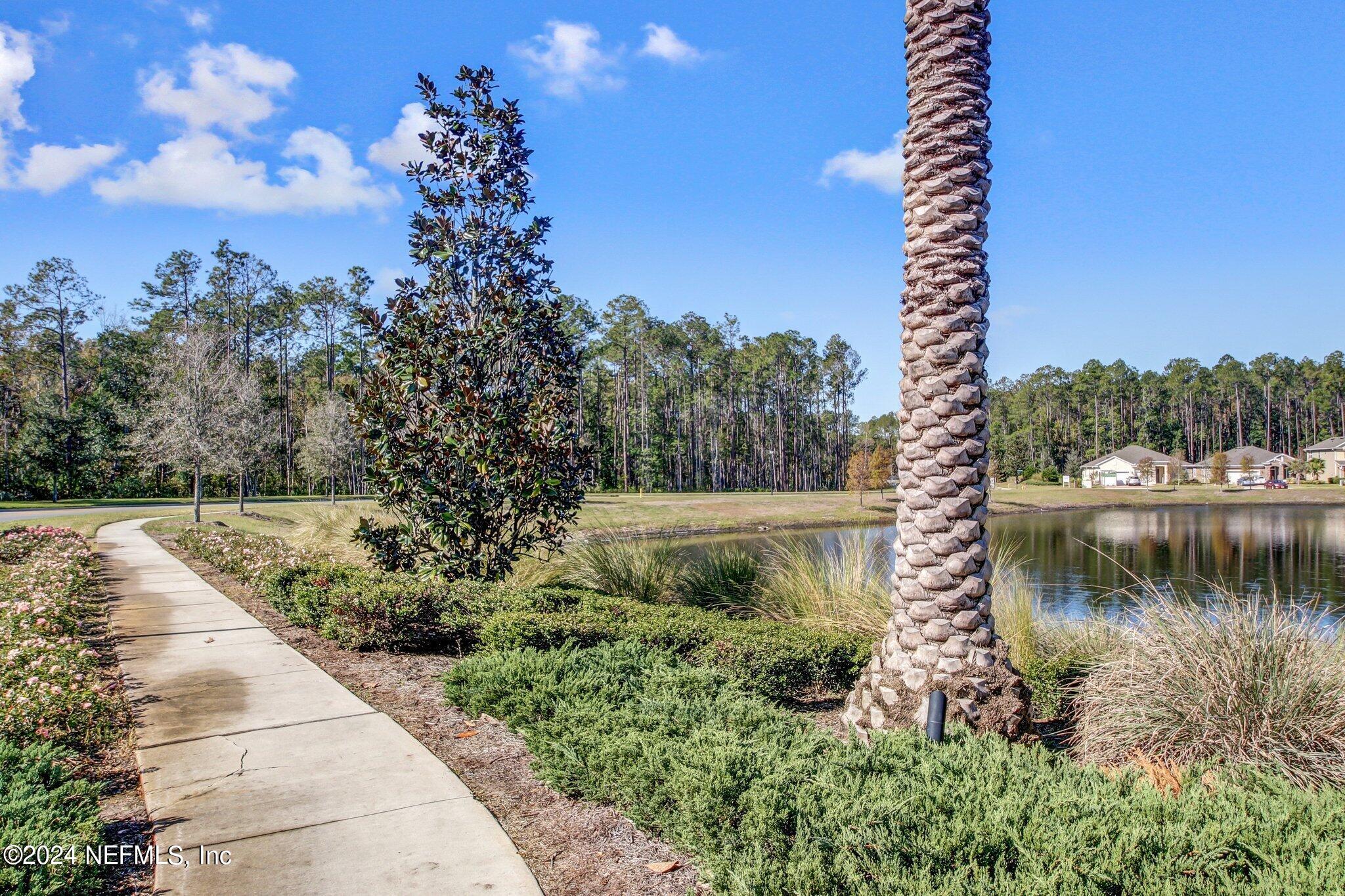 577 Aspen Leaf Drive Jacksonville, FL 32081 - Photo 43 of 106 a view of a lake with a outdoor space