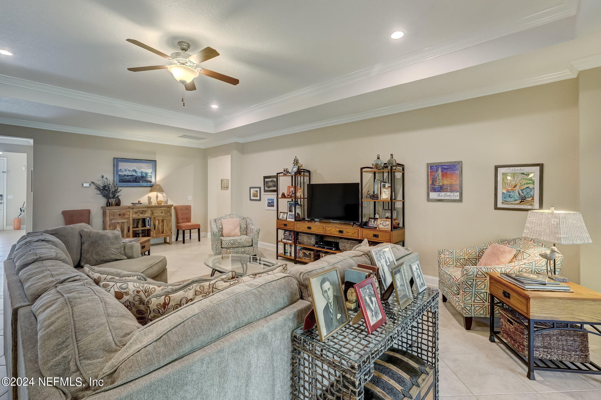 577 Aspen Leaf Drive Jacksonville, FL 32081 - Photo 7 of 106 a living room with furniture and a flat screen tv